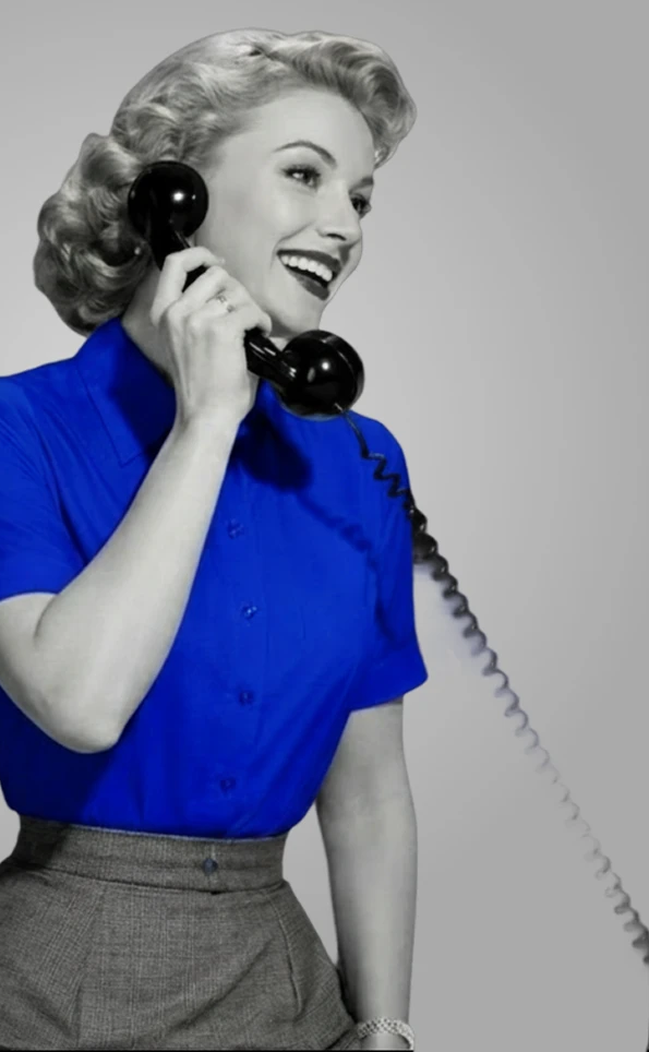 Woman holding a vintage telephone